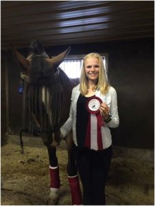 Emma Richardson & Sokit2ya with their First Place ribbon from the Pre-Training Junior division.