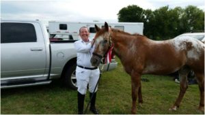 Sylvain and Flash at Meadowvale ESD Dressage Show with their 1st Place Ribbon. 