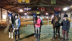 This lesson group came prepared - wearing matching Oakhurst bonnets on their horses! Left to right: Emma & Sokit2ya, Kenzi & Top Gun and Kieryn & King Stag.