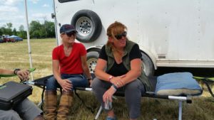 Cindy Moore & Coach Ruth Allum sharing the cot during the impromptu team meeting under the tent at Dewmont Silver Dressage Show.