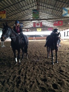 Angelina and Alissia taking part in No Stirrups November in their Saturday morning lesson.