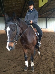 Hannah Ledgerwood practicing riding with the Equicube in her lesson.